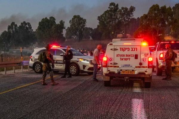 Security and rescue forces near the scene of where a rocket fired from Lebanon hit a car and critically injured two people near Nafah Junction, in the Golan Heights, July 9, 2024 (Photo: Ayal Margolin/Flash90).
