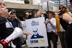 Israelis protest in support of Eli Feldstein and the Israeli soldier accused of leaking classified documents, outside the court in Tel Aviv. Sign reads: Eli thank you. November 27, 2024. Photo by Miriam Alster/Flash90
