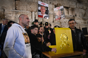 Families of Israeli hostages held by Hamas in Gaza attend a ceremony on the first night the Jewish holiday of Hanukkah, at the Western Wall in Jerusalem Old City, December 25, 2024. Photo by Arie Leib Abrams/Flash90