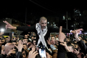 A crowd greets Zakaria Zubeidi who were released in a hostage deal between Israel and Hamas as he arrives to the West Bank city of Ramallah, January 30, 2025. Photo by Flash90