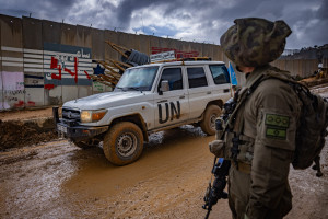 An Israeli soldier look while UN peacekeepers (UNIFIL) patrol in Kfarkela, in southern Lebanon, February 13, 2025. Photo by Yonatan Sindel/Flash90