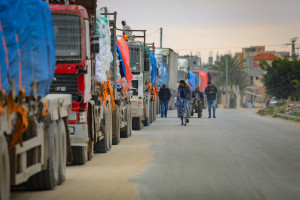Palestinian trucks loaded with humanitarian aid cross into Gaza through the Kerem Shalom crossing, east of the city of Rafah, southern Gaza Strip February 24, 2025. Photo by Ali Hassan/Flash90