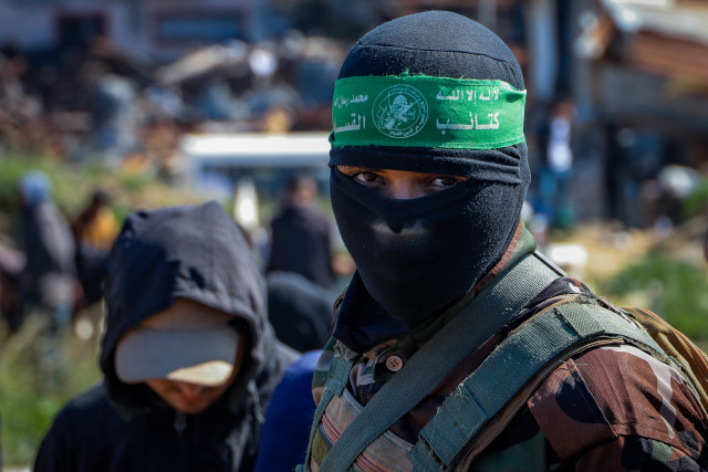 Members of the Al-Qassam Brigades, the military wing of Hamas and mourners attend the funeral of Al-Qassam fighters who were killed during the war between Israel and Hamas in the Al-Shati camp, in Gaza City, February 28, 2025. Photo by Khalil Kahlout/Flash90