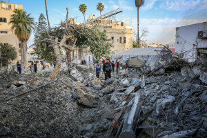 Palestinians inspect the Baptist Hospital building in Gaza City, after it was destroyed in an Israeli airstrike on April 13, 2025. Photo by Ali Hassan/Flash90