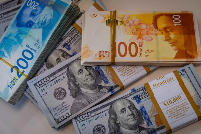 llustration of American 100 dollar bills, 100 and 200 shekel bills, in Jerusalem, May 19, 2025. Photo by Nati Shohat/Flash90