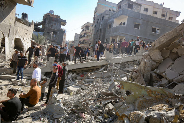 Palestinians at the site of an Israeli airstrike at the Al-Jurn neighborhood, in Gaza City, on May 23, 2025. Photo by Ali Hassan/Flash90