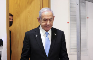 Israeli Prime Minister Benjamin Netanyahu arrives to the courtroom at the Distrcit court in Tel Aviv, before the start of his testimony in the trial against him, June 4, 2025. Photo by Moti Milrod