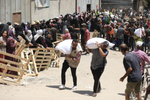 Humanitarian aid is distributed to Palestinians in Gaza City, July 12, 2025. Photo by Ali Hassan/Flash90