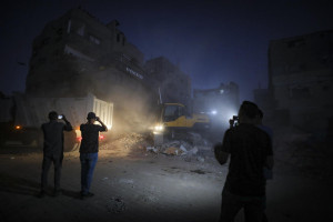Members of the Qassam Brigades use heavy machinery to search for the bodies of Israeli hostages in the Nuseirat refugee camp in the central Gaza Strip, October 27, 2025. Photo by Ali Hassan/Flash90