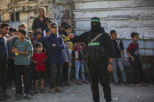 Members of the Qassam Brigades use heavy machinery to search for the bodies of Israeli hostages in the Nuseirat refugee camp in the central Gaza Strip, October 28, 2025. Photo by Ali Hassan/Flash90