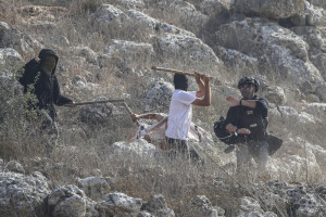 Jewish settlers attack journalists during the olive-picking season in the village of Beita, south of Nablus in the West Bank, November 8, 2025. Photo by Nasser Ishtayeh/Flash90