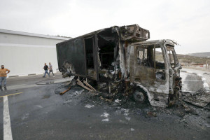 Palestinians inspect burned trucks and cars following an attack by Israeli settlers in the village of Beit Lid, east of Tulkarm, in the West Bank, on November 11, 2025. Photo by Nasser Ishtayeh/Flash90
