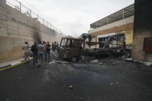 Palestinians inspect burned trucks and cars following an attack by Israeli settlers in the village of Beit Lid, east of Tulkarm, in the West Bank, on November 11, 2025. Photo by Nasser Ishtayeh/Flash90