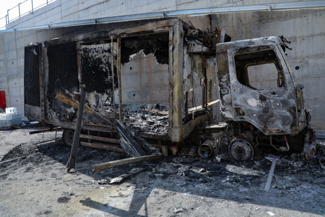Palestinians inspect burned trucks and cars following an attack by Israeli settlers in the village of Beit Lid, east of Tulkarm, in the West Bank, on November 12, 2025. Photo by Nasser Ishtayeh/Flash90