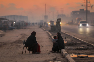 Displaced Palestinians are seen on a street in Nuseirat camp, in the central Gaza Strip, on December 17, 2025. Photo by Ali Hassan/Flash90