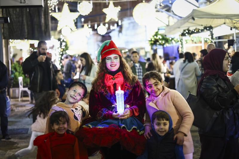 People enjoy a Christmas festival at the New Gate in Jerusalem’s Old City, December 22, 2025. Photo by Jamal Awad/Flash90