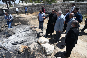 US Ambassador to Israel, Mike Huckabee, visiting the site of an alleged arson attack by Jewish settlers on the historic church ruins of St. George in Tabyeh, Samaria, on July 19, 2025. Photo by Ambassador Huckabee on X.