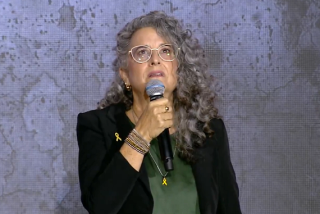 Galit Dan speaks during the national memorial ceremony in Tel Aviv, marking two years since the October 7 massacre. (Screenshot from video on X, photo credit: National Memorial Ceremony)