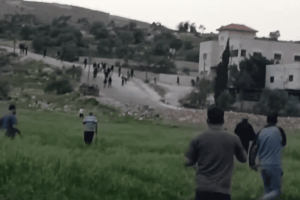Jewish settlers attack the Palestinian village of Duma, southeast of Nablus. Photo: Screenshot from social media footage.