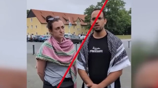 Members of a group wearing keffiyehs who attempted to enter the Buchenwald concentration camp site to protest the Gaza war. (Screenshot)