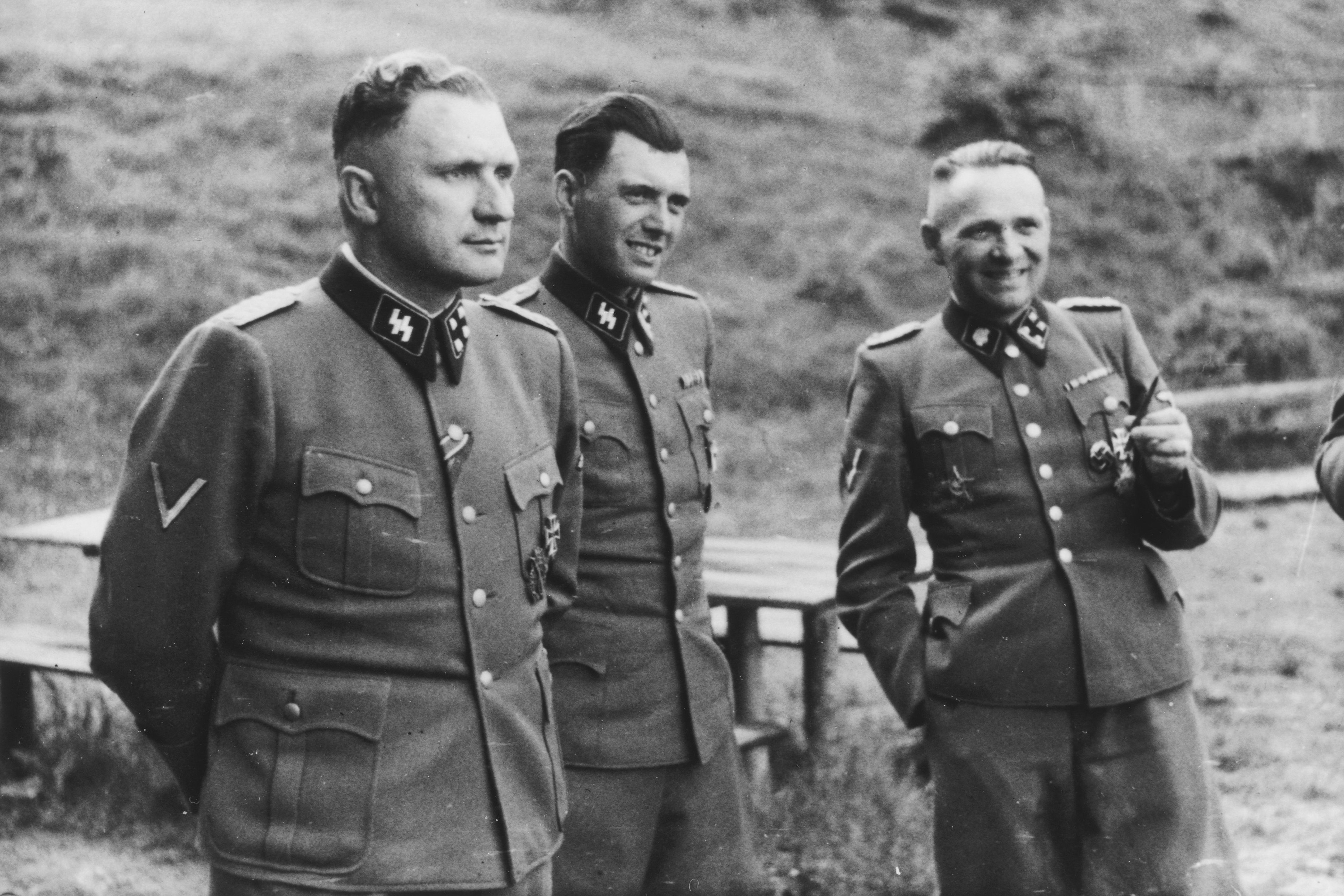 Auschwitz, Poland, Three SS officers socialize on the grounds of the SS retreat outside of Auschwitz, at “Solahütte”, 1944. From left to right they are: Richard Baer (Commandant of Auschwitz), Dr. Josef Mengele and Rudolf Hoess (the former Auschwitz Commandant). 1933 (probably 29 July) Photo: Wikimedia Commons