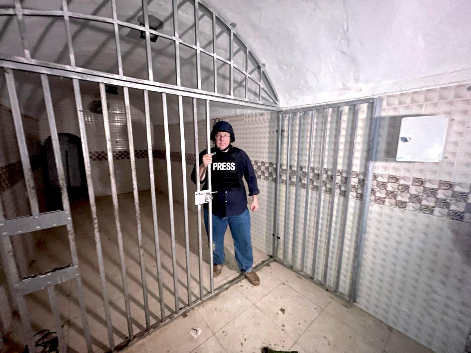 ALL ISRAEL NEWS Editor-in-Chief Joel C. Rosenberg stands inside cage in a terror tunnel deep under Khan Yunis in Gaza where as many as twelve Israelis hostages were recently held. (Photo credit: All Israel News and TBN staff)