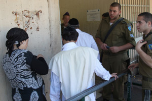 Ultra-orthodox Jewish men arrive at the Bakum Reception and Sorting base in Tel Hashomer in Israel, on August 1, 2013. The largest numbers so far of ultra-orthodox new recruits to the Israeli army arrived at the Bakum army base on August 1. Most of them are expected to be absorbed in the Netzah Yehuda Battalion, under the Nahal Haredi. Photo by Flash90