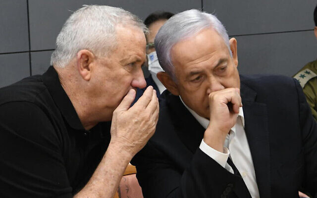 Former defense minister Benny Gantz and Prime Minister Benjamin Netanyahu during a consultation amid Hamas rocket fire at Israel and IDF counterstrikes, May 11, 2021. (Amos Ben Gershom / GPO / File)