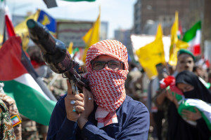 A Palestinian man holding an Al-Yassin 105 anti-tank rocket launcher during International Al-Quds Day in Tehran, Iran, April 5, 2024. (Photo: Shutterstock)